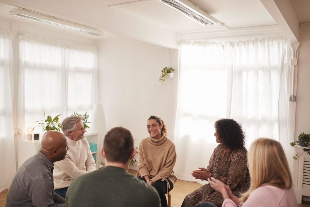 Woman Speaking in a Small Support Group