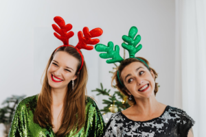 Photo of two female friends celebrating christmas.